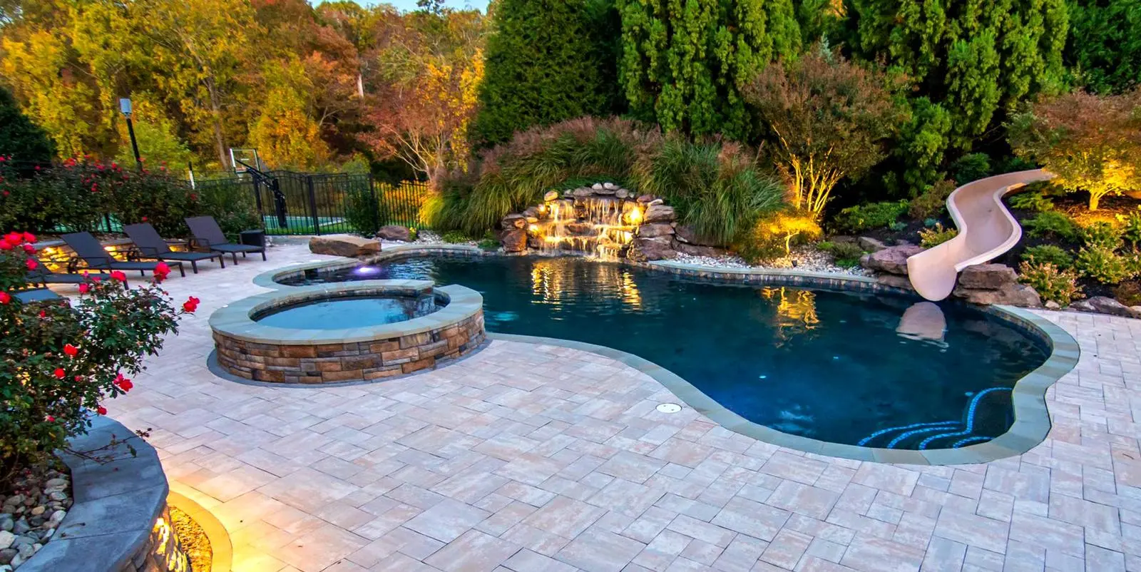 Custom freeform pool with grotto and slide built by K&D Pools in Fredericksburg Virginia